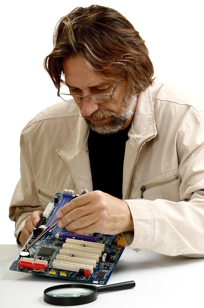 Experienced technician guiding through computer repair steps