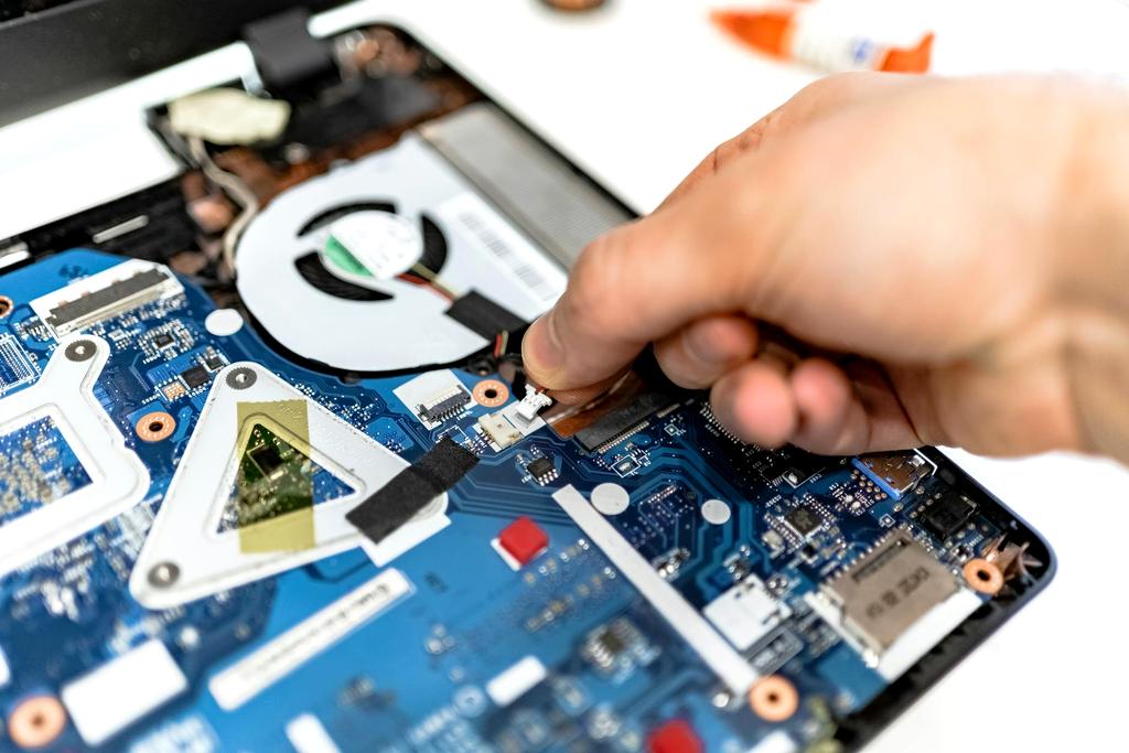 Modern workspace with computer repair tools and diagnostic setup